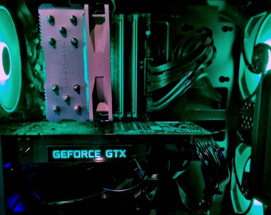 Revolt Relic build — Thermalright cooling + GTX + ARGB accents through clear side panel